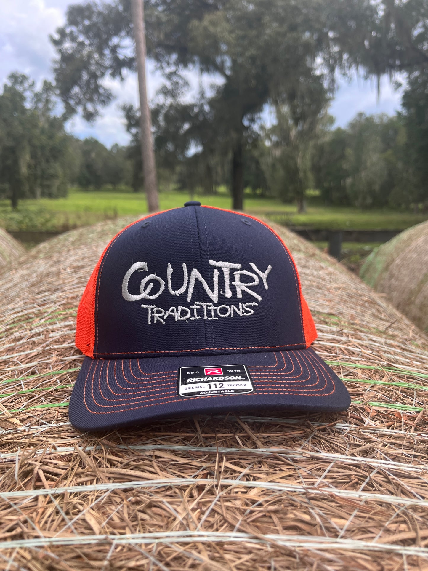 Original Logo Silver Stitch Navy/Orange Trucker Hat